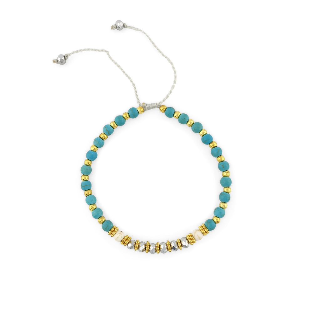 Bracelet with turquoise and gold beads and silver crystal
