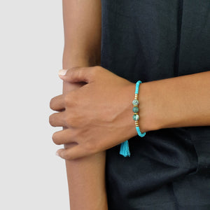 
                  
                    Load image into Gallery viewer, Lucky gemstone bracelet turquoise tassel on model
                  
                