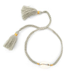 Boho handmade shell bracelet tassel light grey front view