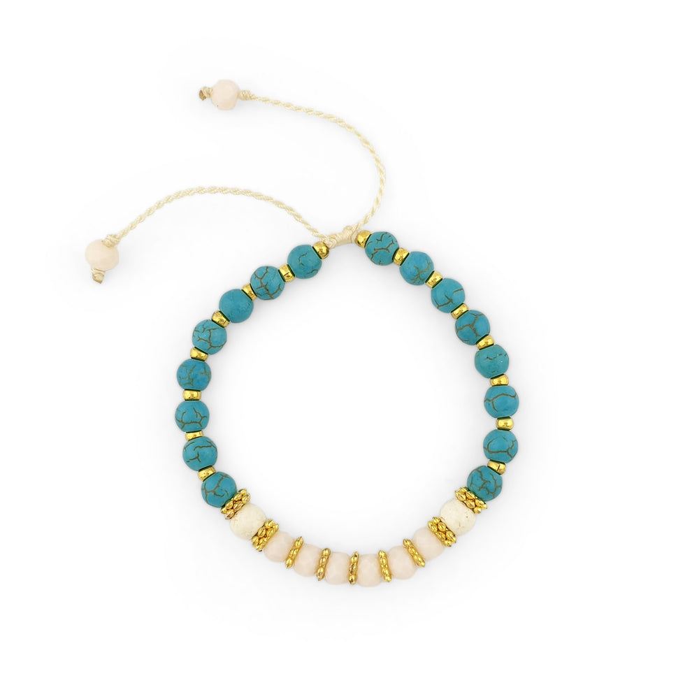 
                  
                    Load image into Gallery viewer, Turquoise Bracelet with gold beads and white crystals
                  
                