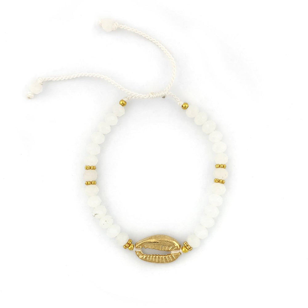 
                  
                    Load image into Gallery viewer, Bracelet with white crystals and gold brass shell
                  
                