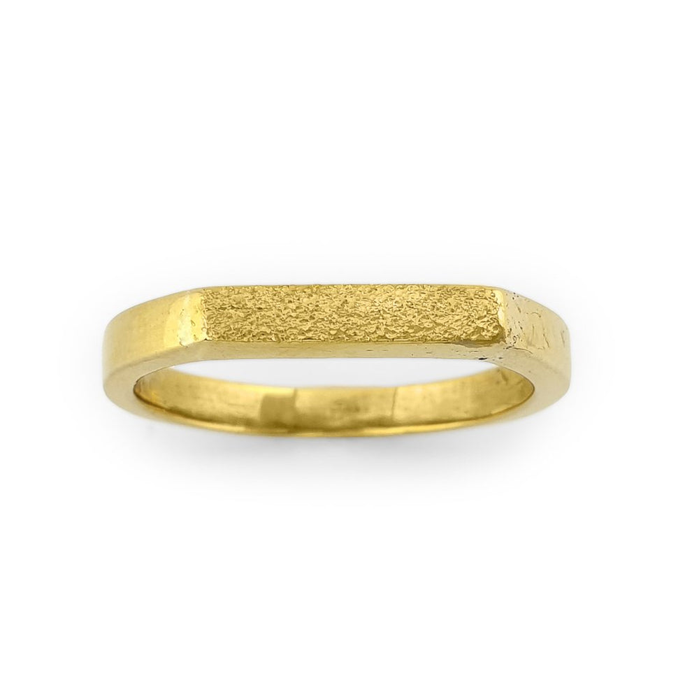 Brass gold color ring with flat and hammered front surface