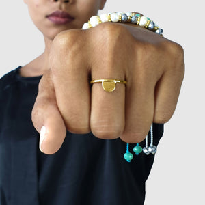 
                  
                    Load image into Gallery viewer, Brass gold color ring with hammered half moon shape on model
                  
                
