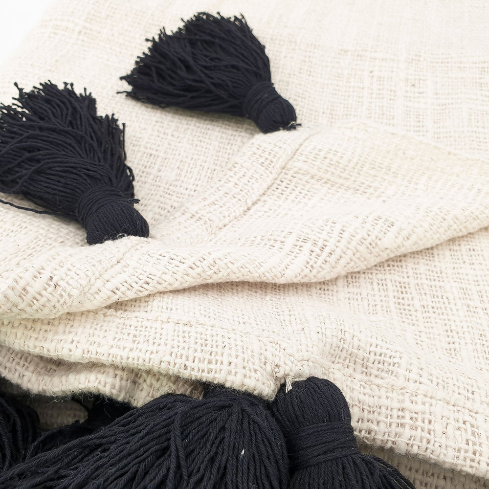 
                  
                    Load image into Gallery viewer, Handmade boho Cotton blanket with black tassel cream color detail
                  
                