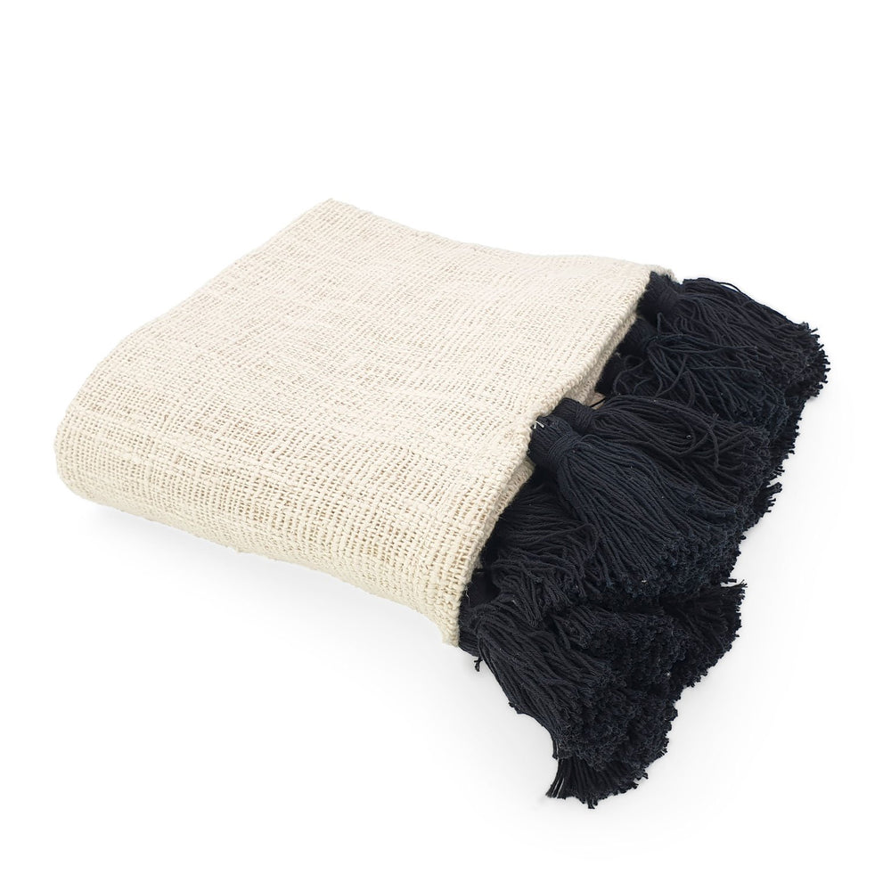 
                  
                    Load image into Gallery viewer, Handmade boho Cotton blanket with black tassel cream color side view
                  
                
