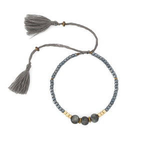 
                  
                    Load image into Gallery viewer, Lucky gemstone bracelet grey tassel front
                  
                