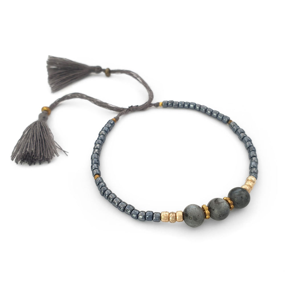 
                  
                    Load image into Gallery viewer, Lucky gemstone bracelet grey tassel side view
                  
                