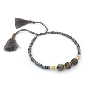 
                  
                    Load image into Gallery viewer, Lucky gemstone bracelet grey tassel side view
                  
                
