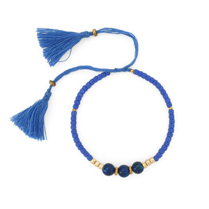 
                  
                    Load image into Gallery viewer, Lucky gemstone bracelet light blue tassel front view
                  
                
