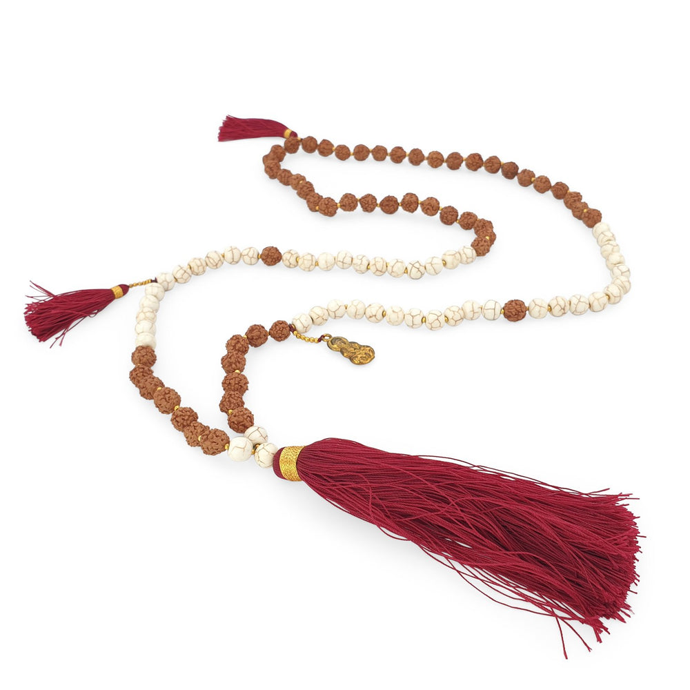 
                  
                    Load image into Gallery viewer, Handmade Buddha rudraksha and howlite mala necklace with maroon tassel angle
                  
                