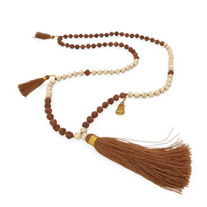 
                  
                    Load image into Gallery viewer, Handmade Buddha rudraksha and howlite mala necklace with brown tassel angle
                  
                