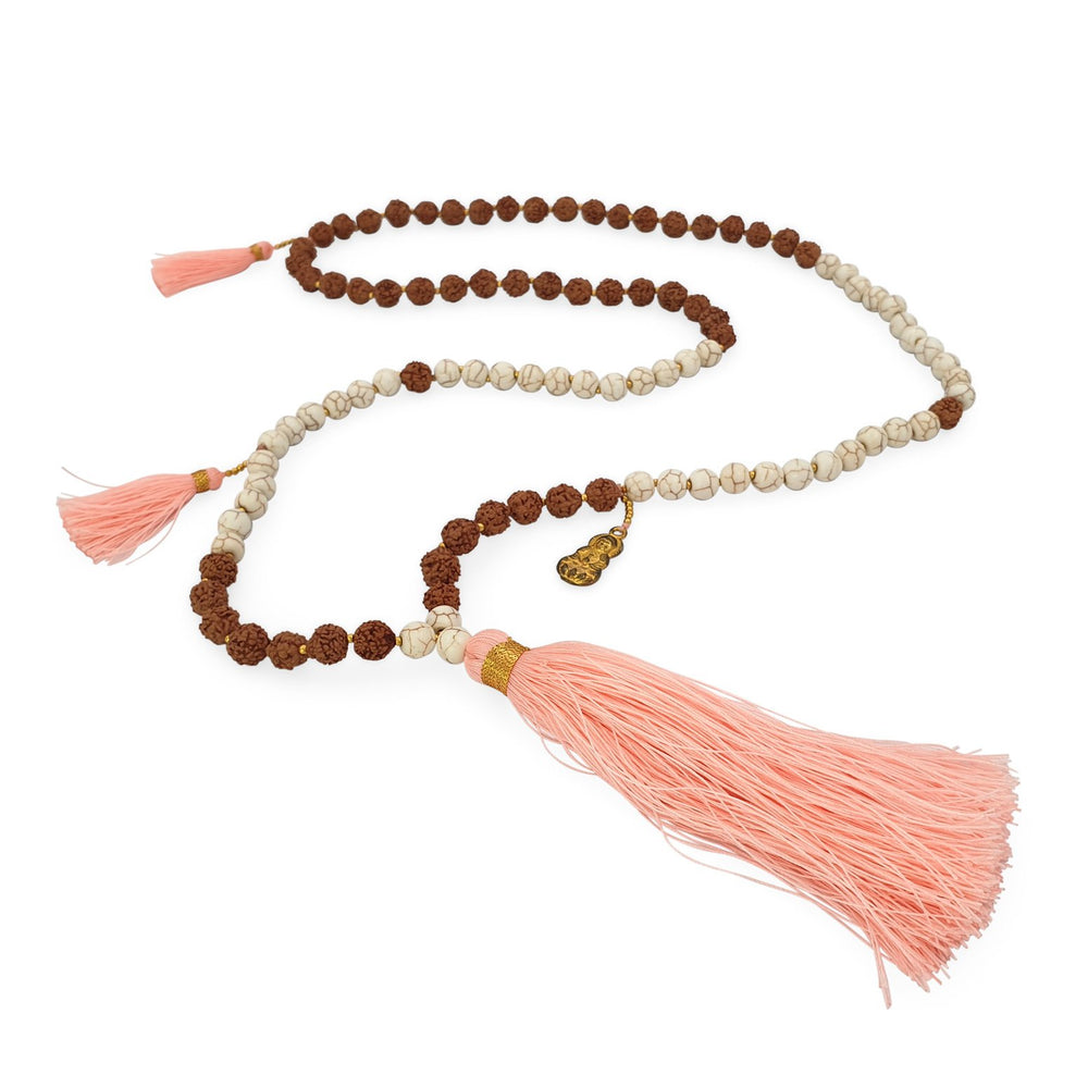 
                  
                    Load image into Gallery viewer, Handmade Buddha rudraksha and howlite mala necklace with pink tassel angle
                  
                