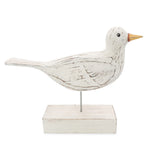 Wooden bird statue white side view