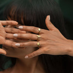 gold geometric rings on model