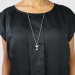 necklace animal charm bird silver white stone on model
